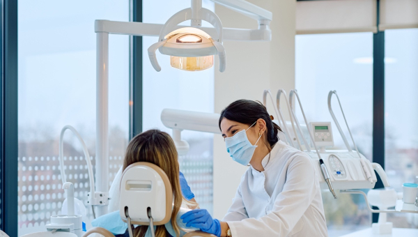 A dentist educating their patient using OrthoPhoto